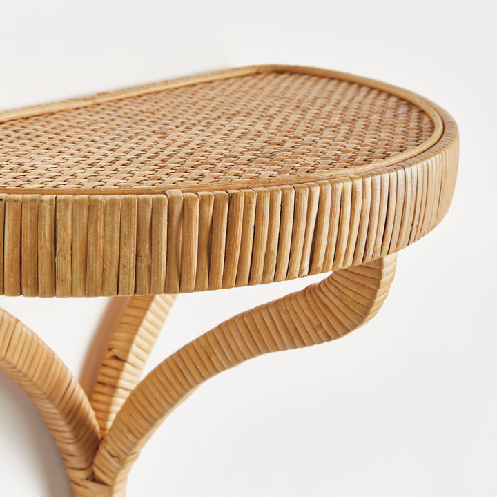 Rattan shelf detailing on a white background. Coastal Compass Home Decor