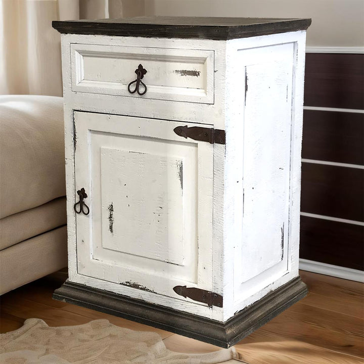 White distressed nightstand with a wooden top in a bedroom setting