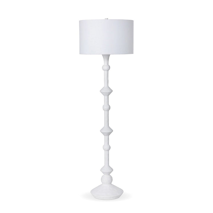 White floor lamp with a white shade on a white background