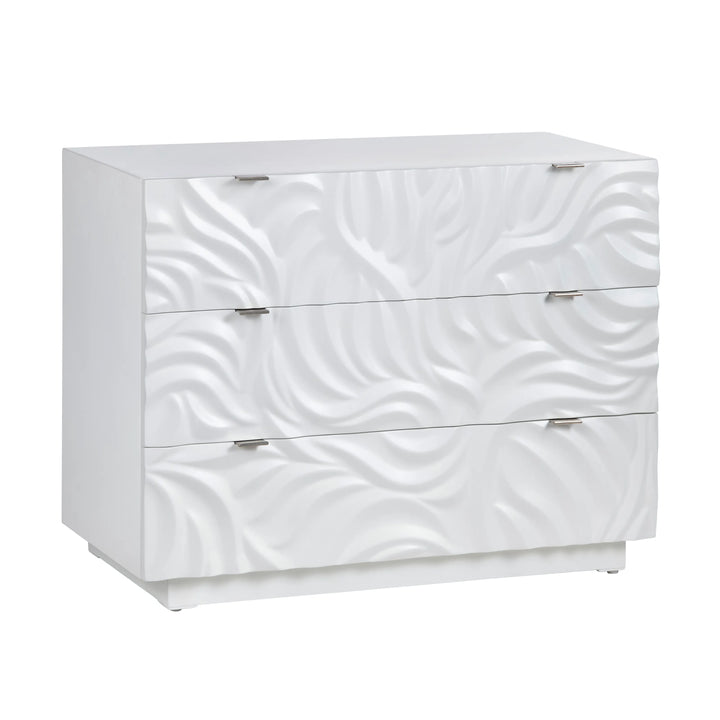 A white 3-drawer chest with a wave-like pattern and silver handles.