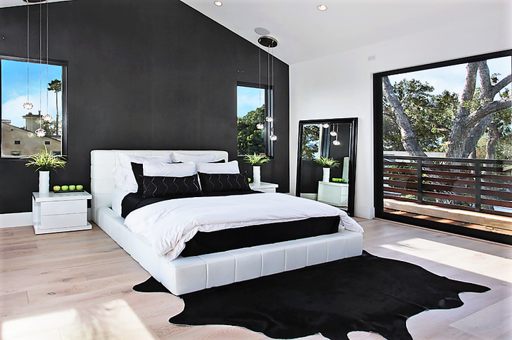 dyed black Brazilian cowhide in bedroom - The Coastal Compass Home Decor