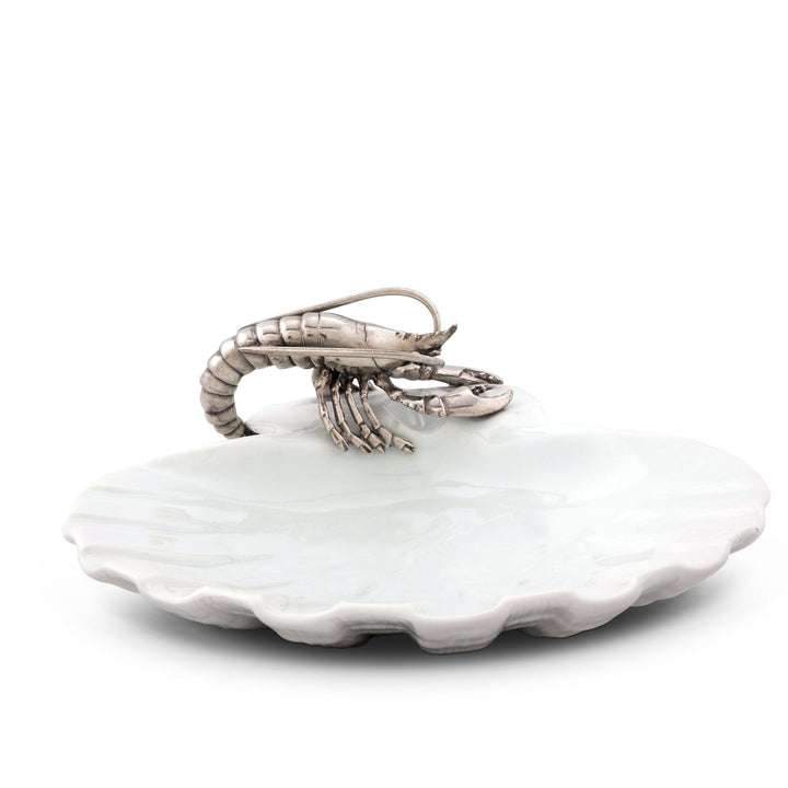 White ceramic shell with a silver shrimp on a white background