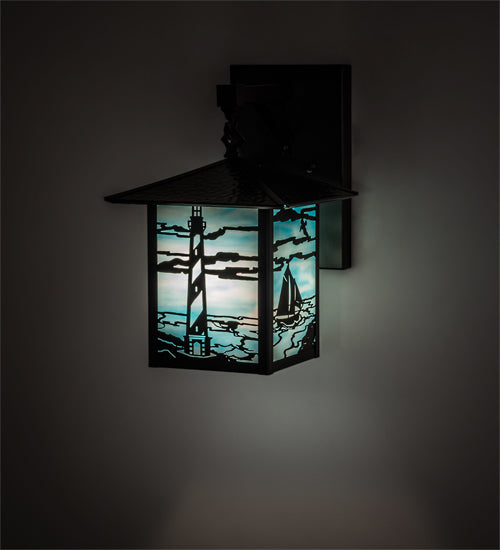American made Coastal Nautical Lighting Wall Sconce in sky blue art glass with lighthouse and sailboat on the blue sea - Coastal Compass Home Decor