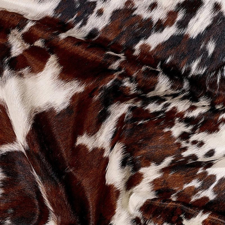 Brazilian tri-color cowhide detail - The Coastal Compass Home Decor