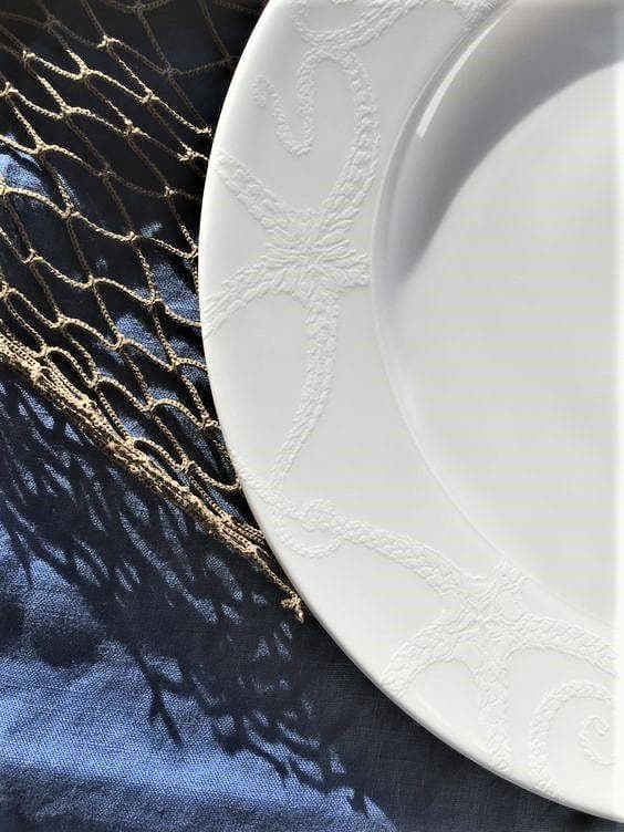 Bone china white textured dinner and salad plates set with starfish