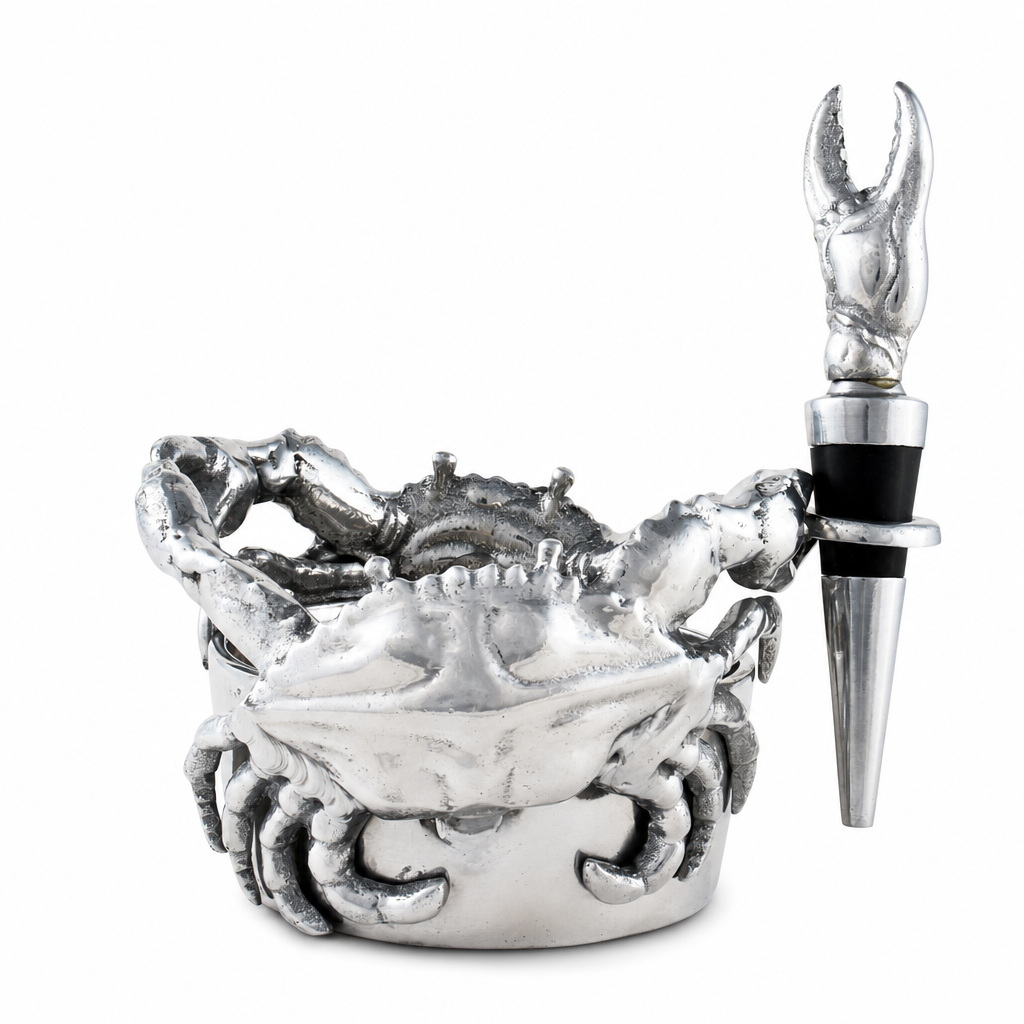 A silver-toned lobster claw wine bottle stopper resting beside a matching silver crab-shaped bowl, photographed on a clean white background.