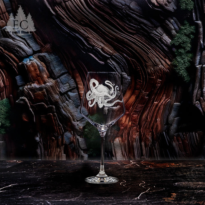 Decorative wine glass with octopus carved design on a dark wooden background