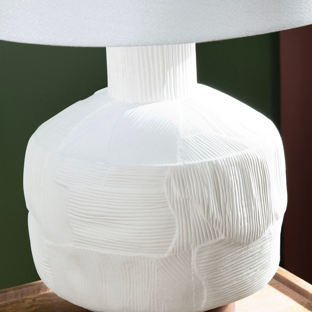 Alora Ceramic Table Lamp with ceramic textured body and white shade on a styled background