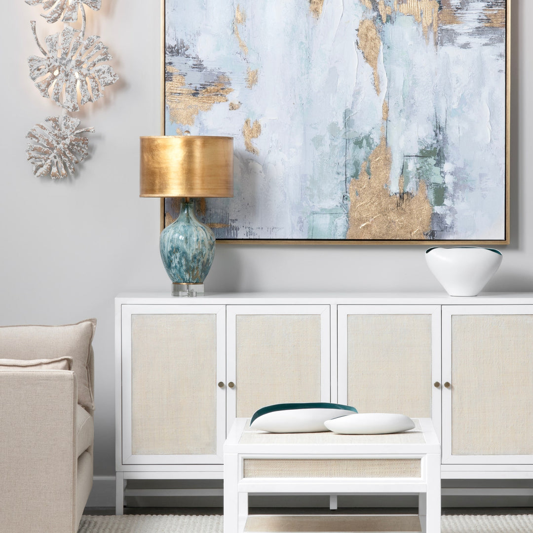 Aurelia Ocean Glass Lamp styled on white console table with coastal wall art and neutral decor