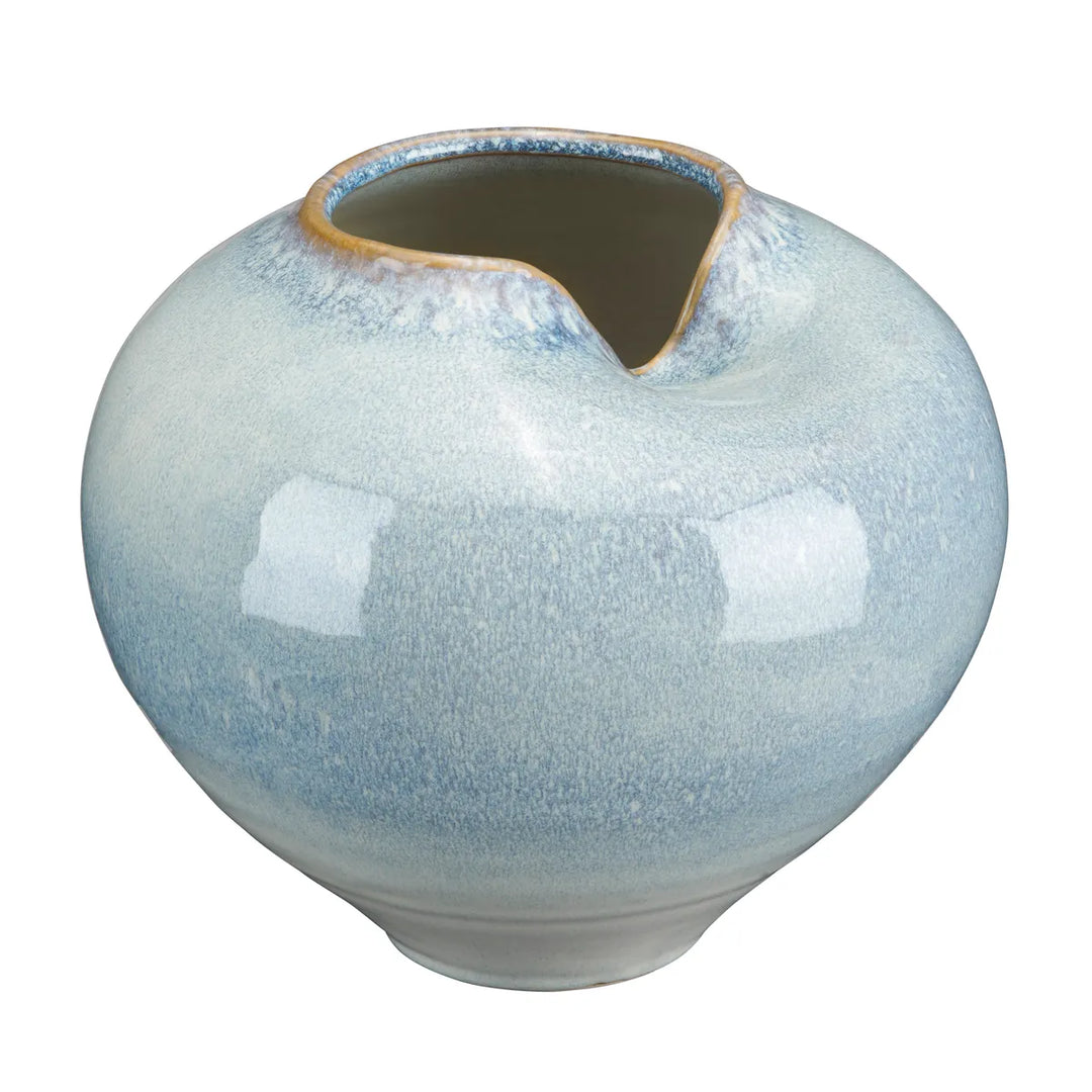 A round ceramic vase with a unique asymmetrical slant spout, featuring a glossy light blue and white marbled glaze with subtle brown speckles and a natural unglazed rim.