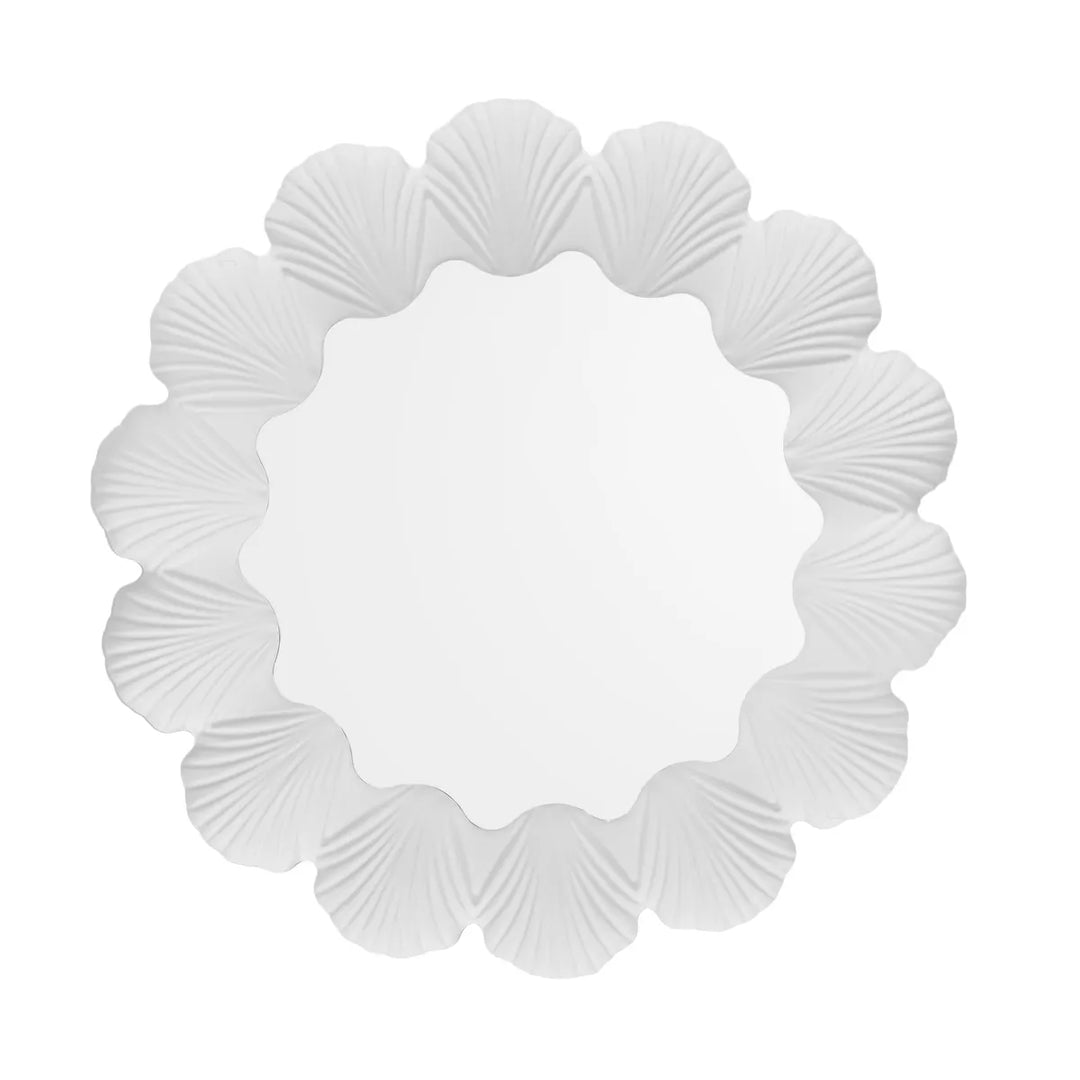 Decorative wall mirror with seashell frame on a white background