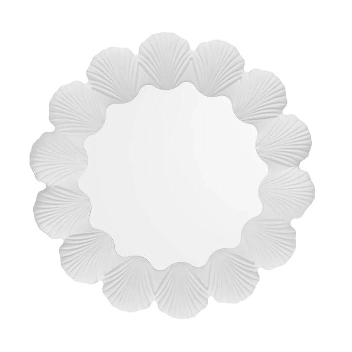Decorative wall mirror with seashell frame on a white background
