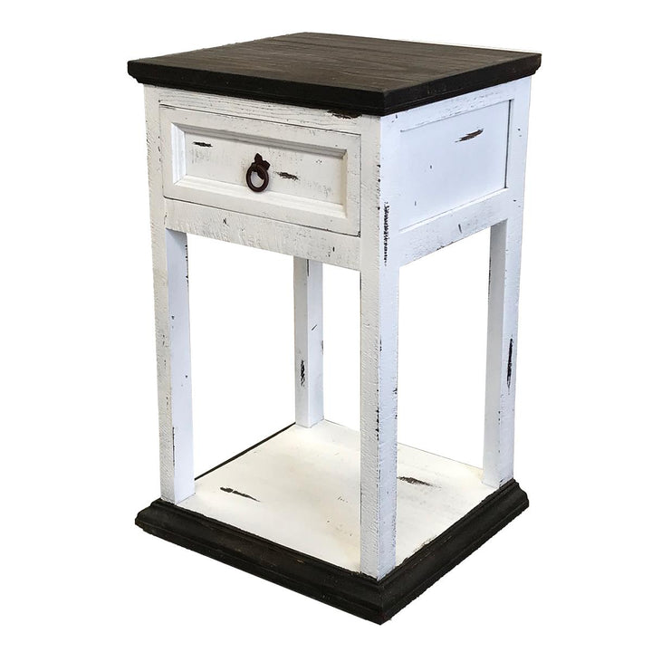 Small wooden side table with a white distressed finish and black top on a white background