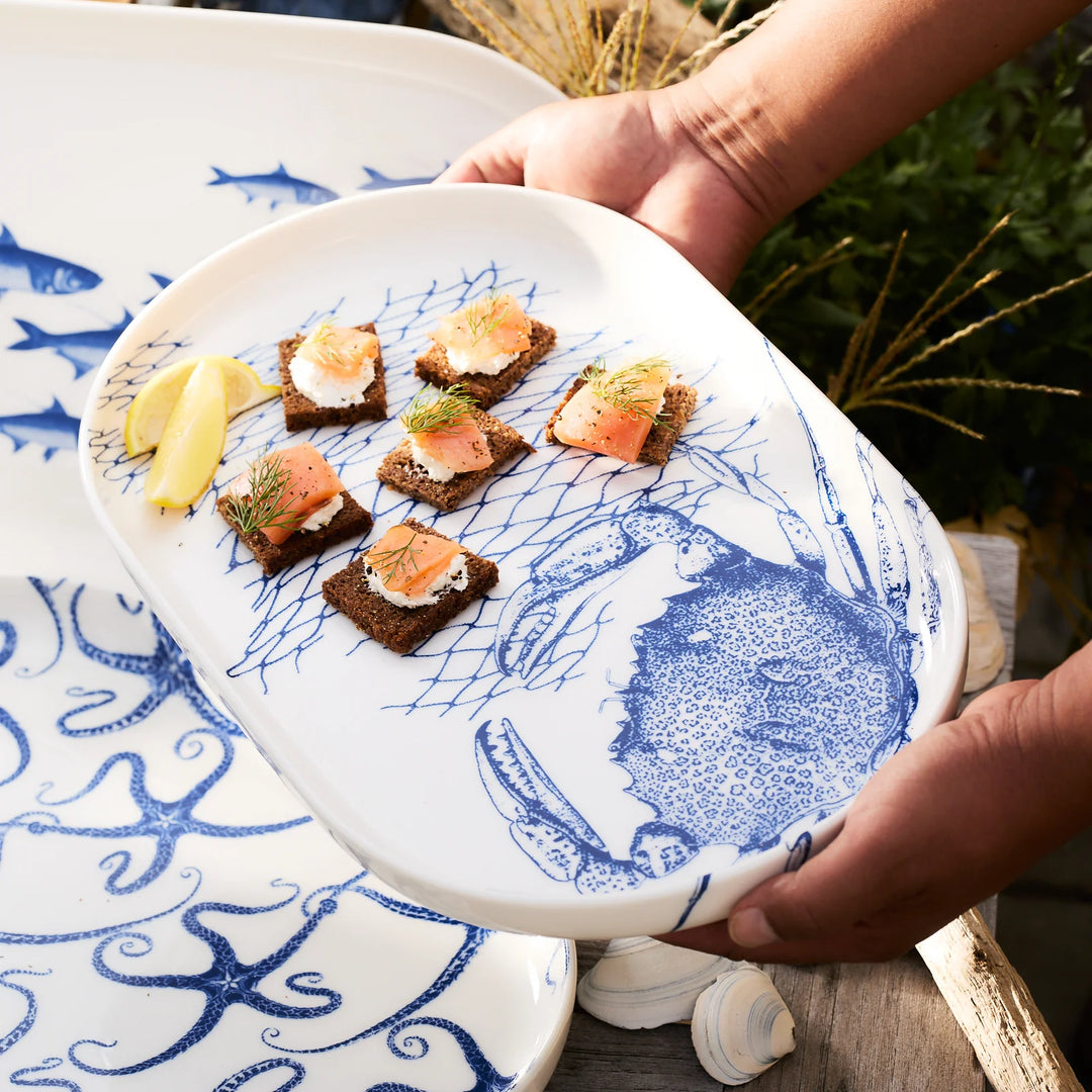 Crab Coupe Oval Platter - Blue Crab in net on white porcelain - Coastal Compass Home Decor