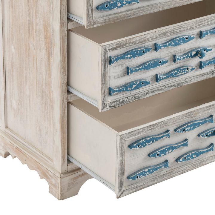 Wooden dresser with blue fish designs on the drawers