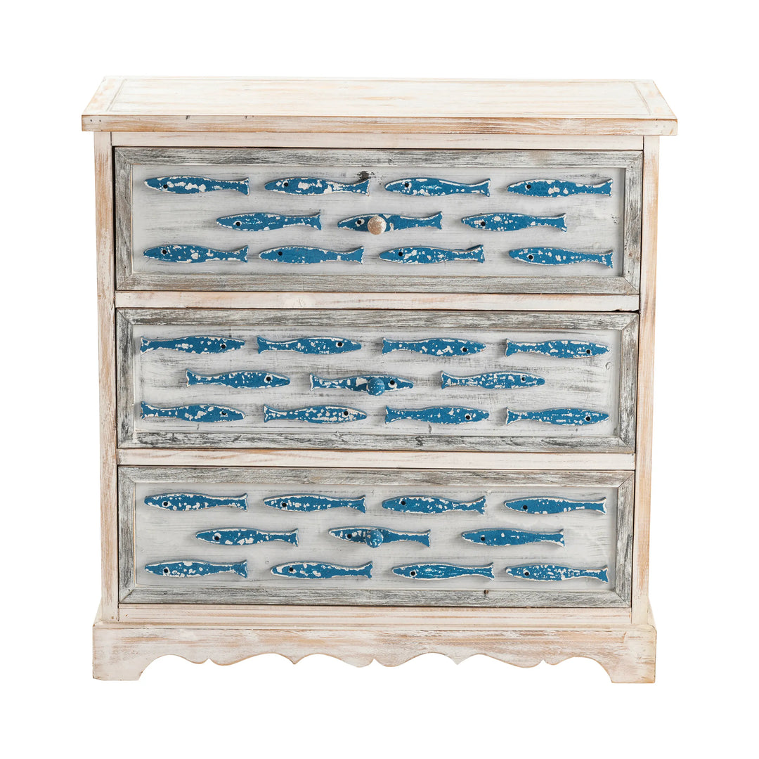 Wooden dresser with blue fish decals on a white background