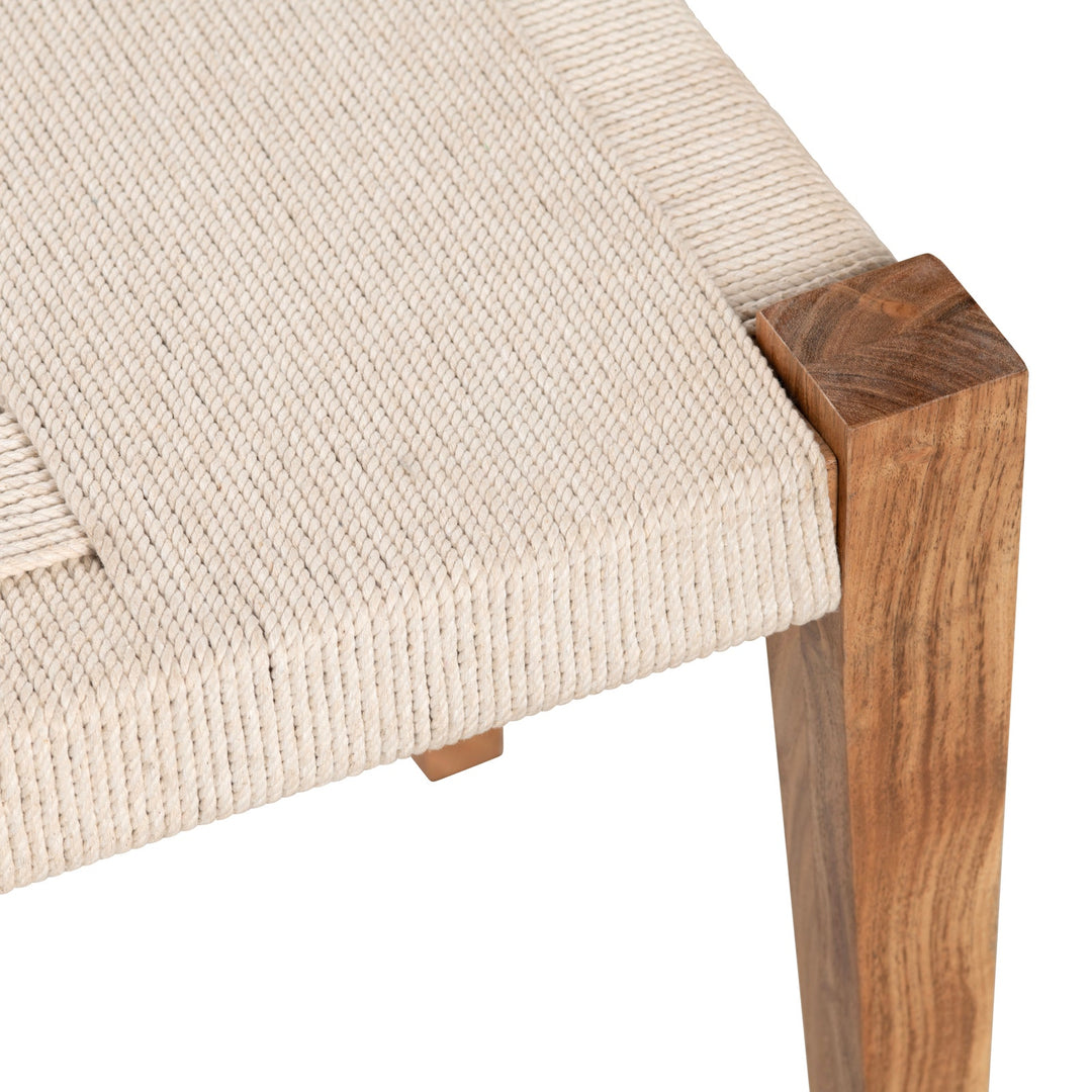 Close-up of handwoven rope seat on a natural wood bench showcasing texture, craftsmanship, and warm coastal materials