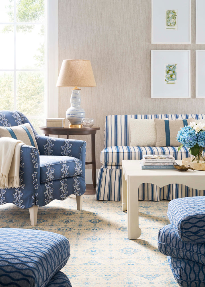 Living room with blue and white striped furniture and decor. Coastal Compass Home Decor