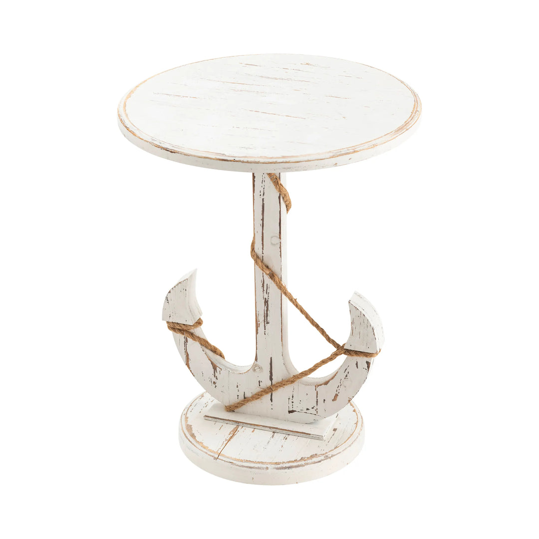 White distressed side table with an anchor design on a white background