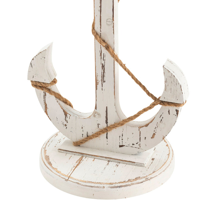 Decorative wooden anchor with rope on a white background
