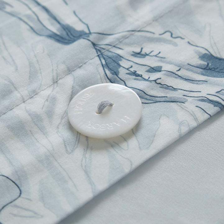 Harbor Reef duvet cover shell button closure detail on blue coral cotton sateen bedding