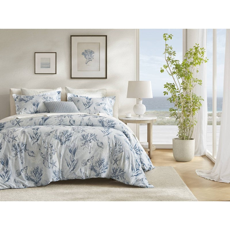 Harbor Reef coastal duvet cover set with blue coral and seashell pattern styled in a bright coastal bedroom