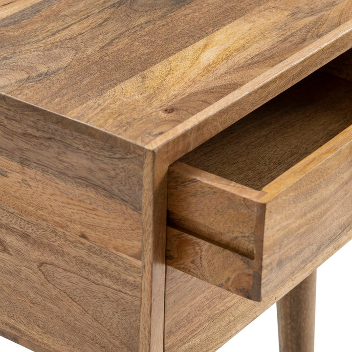 Close-up of a wooden side table showing the top surface, front drawer, and wood grain texture against a white background.