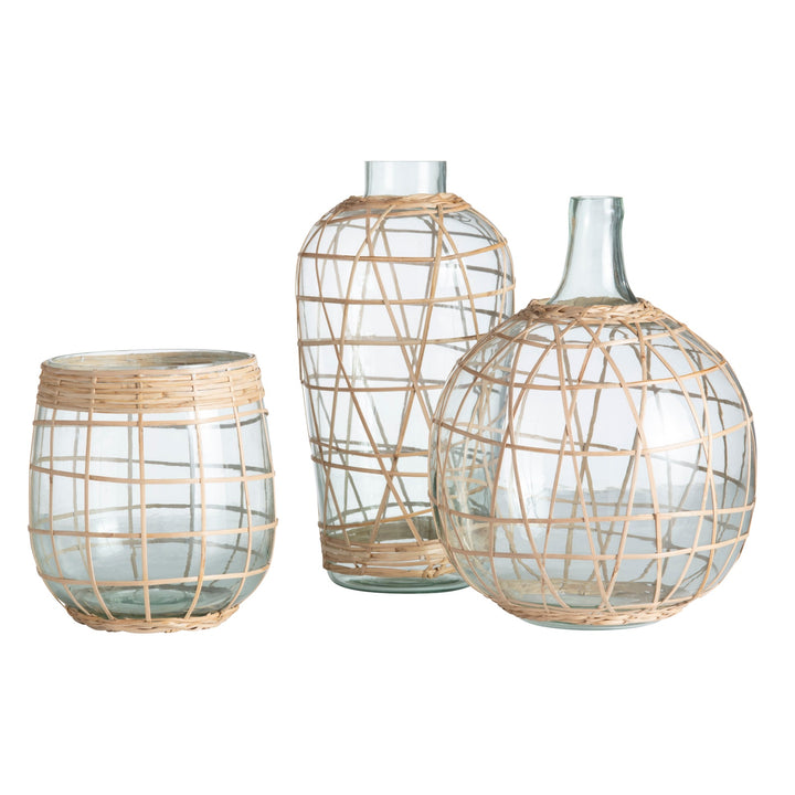 Three glass vases with woven natural materials on a white background