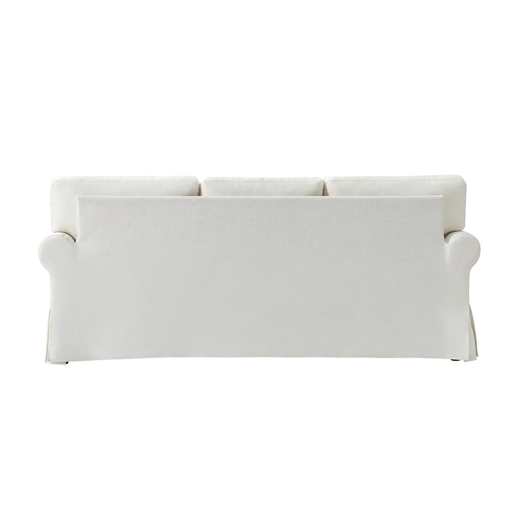 Back view of white slipcovered sofa with tailored linen cover and clean lines - Whitehaven sofa