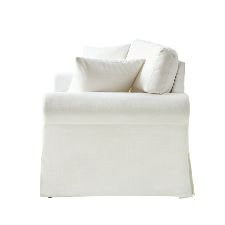 White Ivory slipcovered sofa side view with rolled arm and soft neutral upholstery - Whitehaven sofa