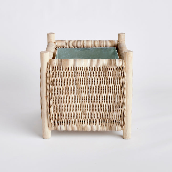 London Medium coastal rattan planter with teak legs and square woven design