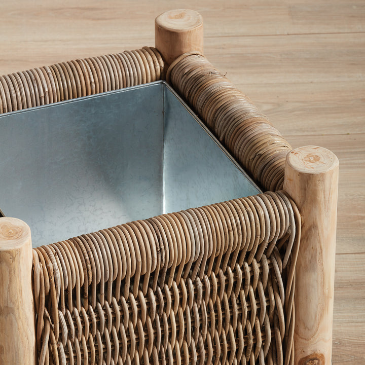 Detail of London Small rattan planter showing handwoven texture and solid teak corner posts
