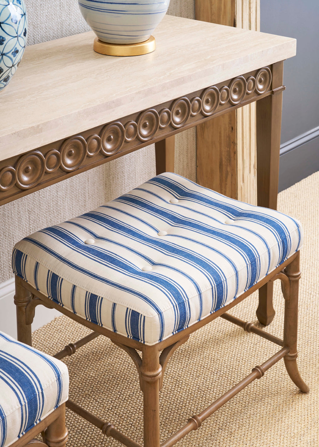 Striped stool with a wooden frame in a room setting. Coastal Compass Home Decor