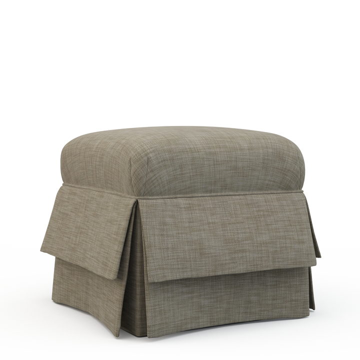 Gray upholstered ottoman with a skirt on a white background