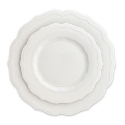 Three nested round ceramic plates with scalloped edges in a glossy white finish, photographed from directly above on a white background.
