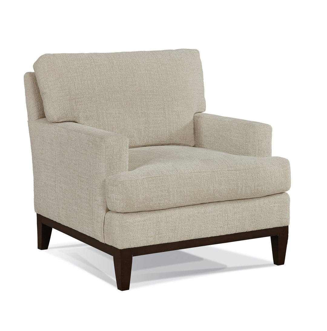 Beige armchair with dark wood legs on a white background