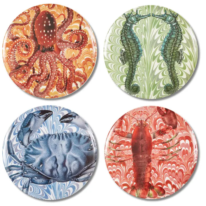 Set of four coastal melamine plates featuring lobster, octopus, crab, and seahorse artwork on colorful marbleized backgrounds.