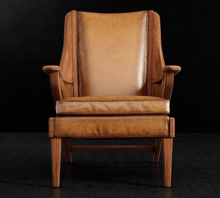 Brown leather armchair on a black background. Coastal Compass Home Decor