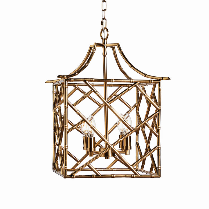 Decorative brass pendant light with geometric design on a white background. Coastal Compass Home Decor