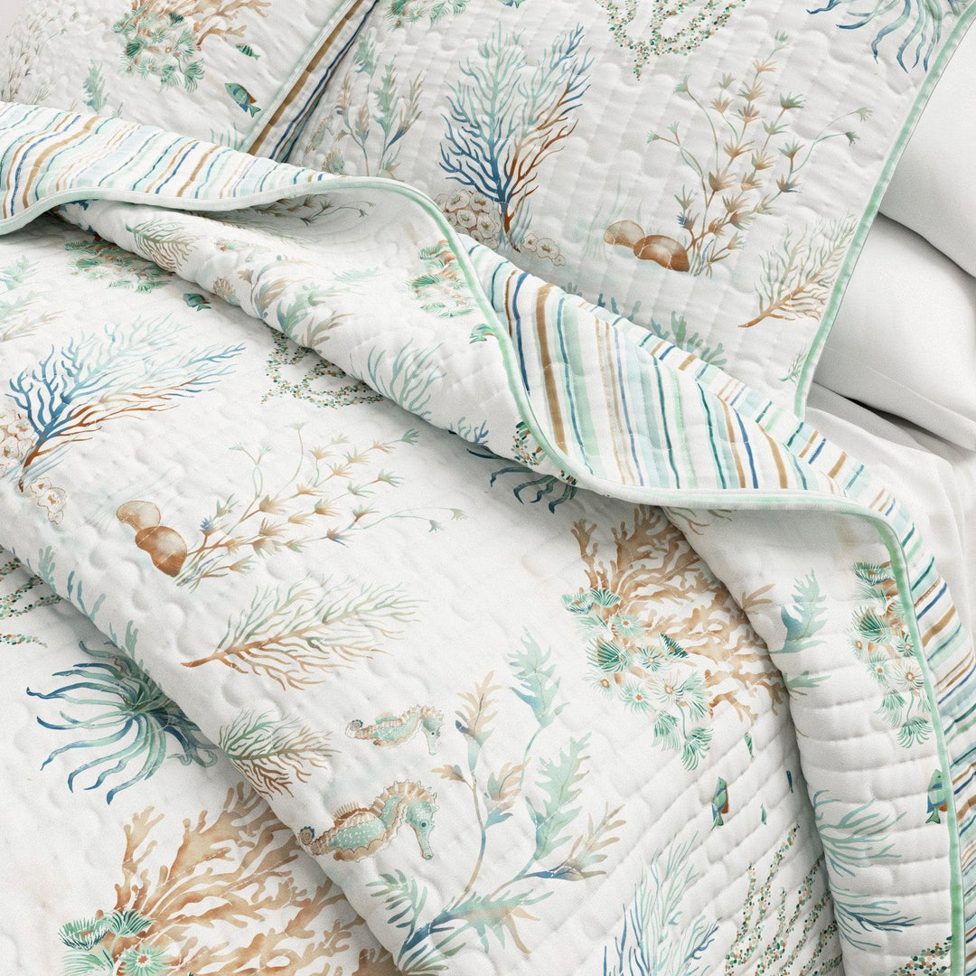Santa Barbara Quilt with ocean-themed design featuring seahorses and coral on a white background