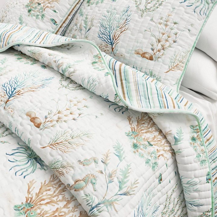 Santa Barbara Quilt with ocean-themed design featuring seahorses and coral on a white background