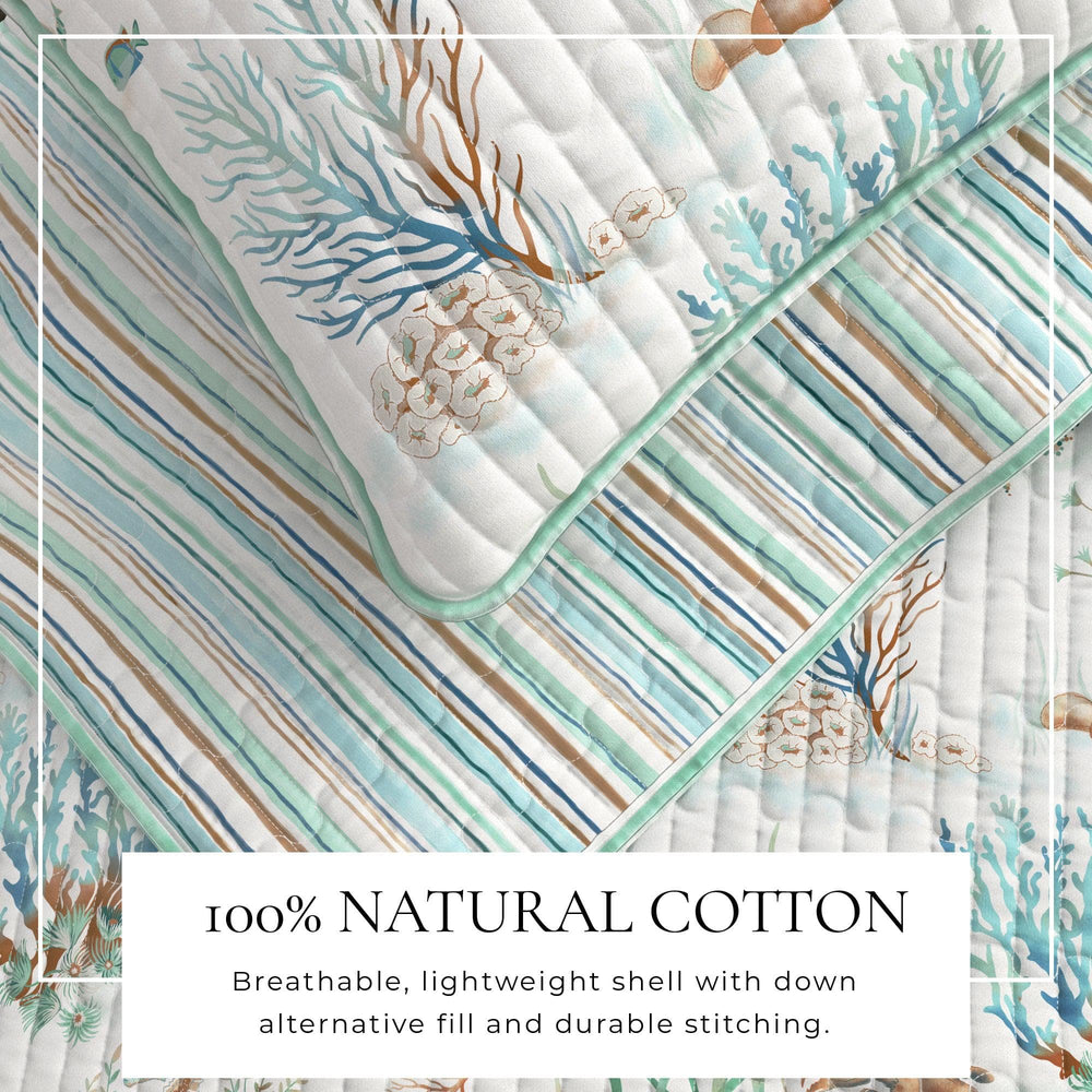 Santa Barbara quilt with coral and shell pattern on a white background