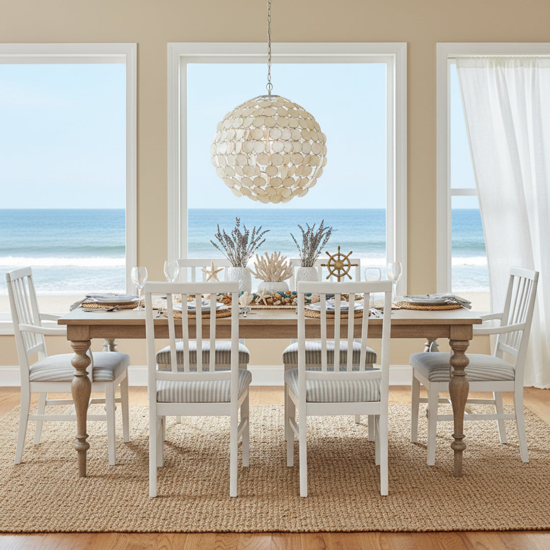 Santorini dining table styled in bright coastal dining space with ocean view