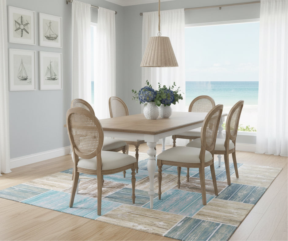 Santorini dining table styled in bright coastal dining space with ocean view