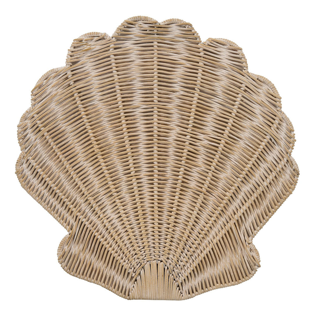 A scallop-shaped woven rattan placemat in a natural light tan color, isolated on a white background.