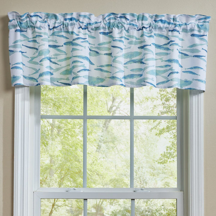 Window valance with blue and green watercolor fish design on a window