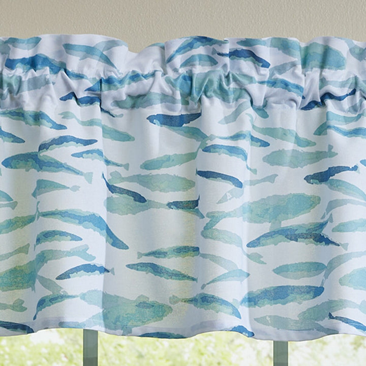 Window valance with blue fish pattern on a white background