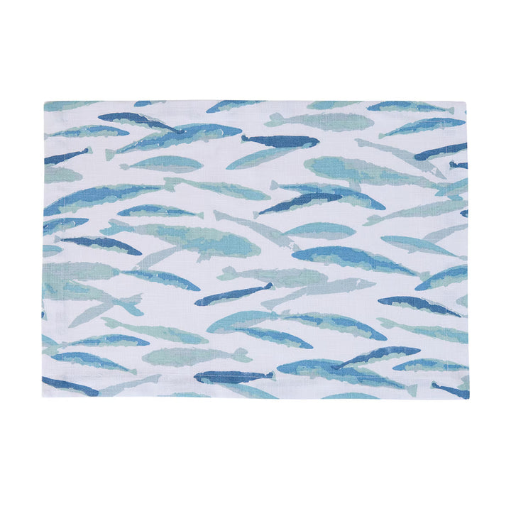 Patterned placemat with blue and green fish design on a white background