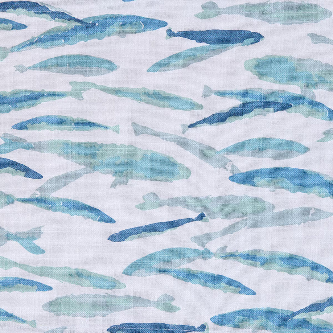 Pattern of blue fish illustrations on a light blue background placemat