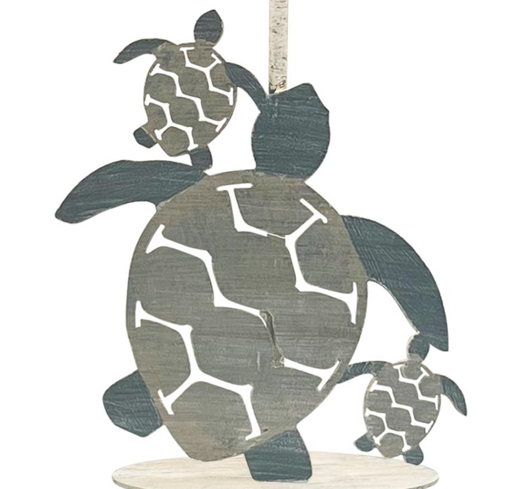 Close-up of turtle reef lamp base with carved turtle shapes and coastal finish